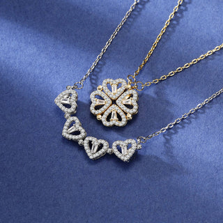 Gold and silver necklaces with heart and butterfly pendants on a blue background